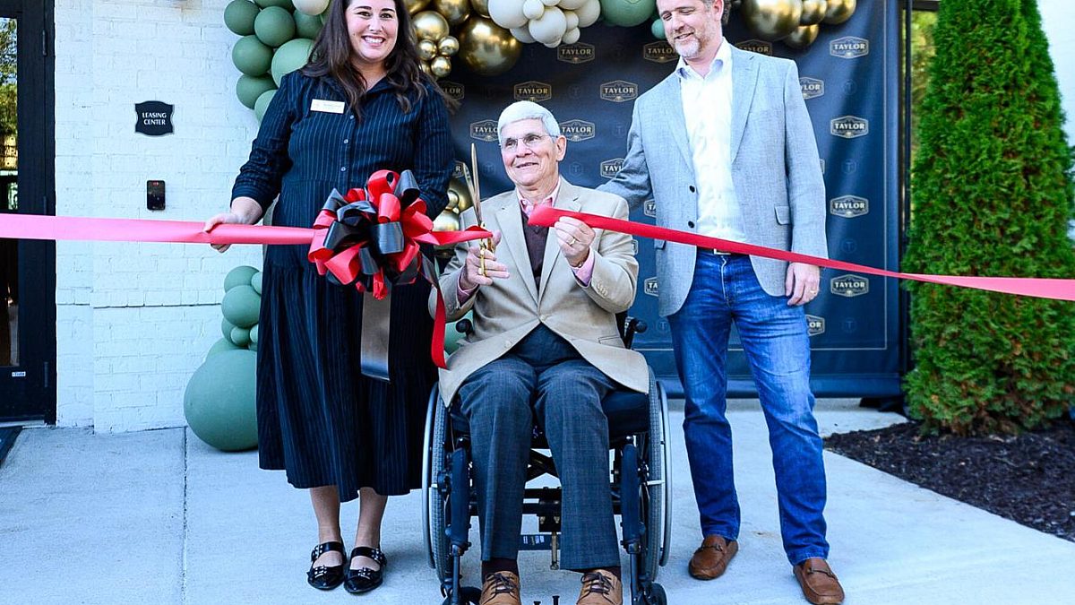 Taylor ribbon cutting